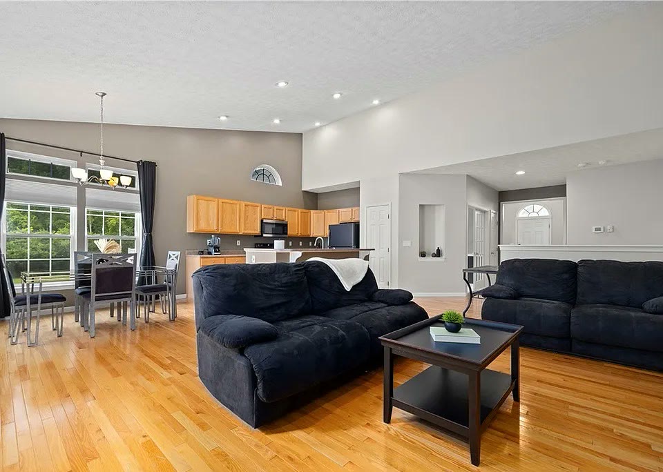 Vaulted great room with hardwood floors at 5052 Forestland Ct