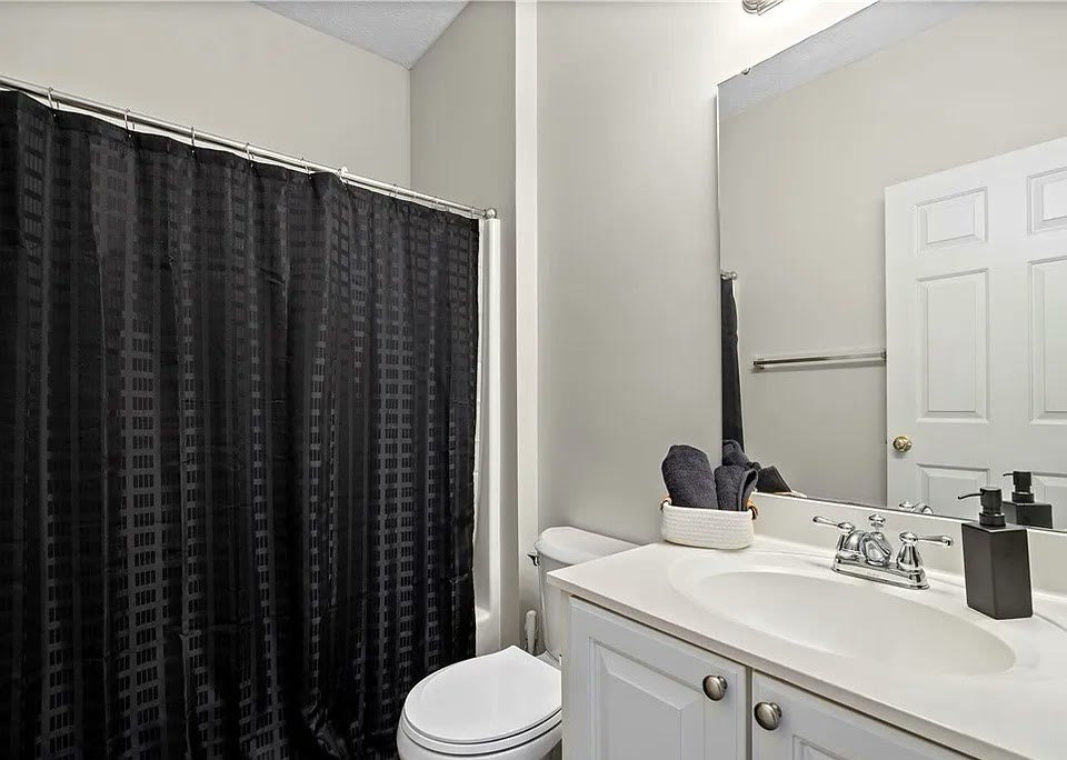 Second full bathroom with tub and shower